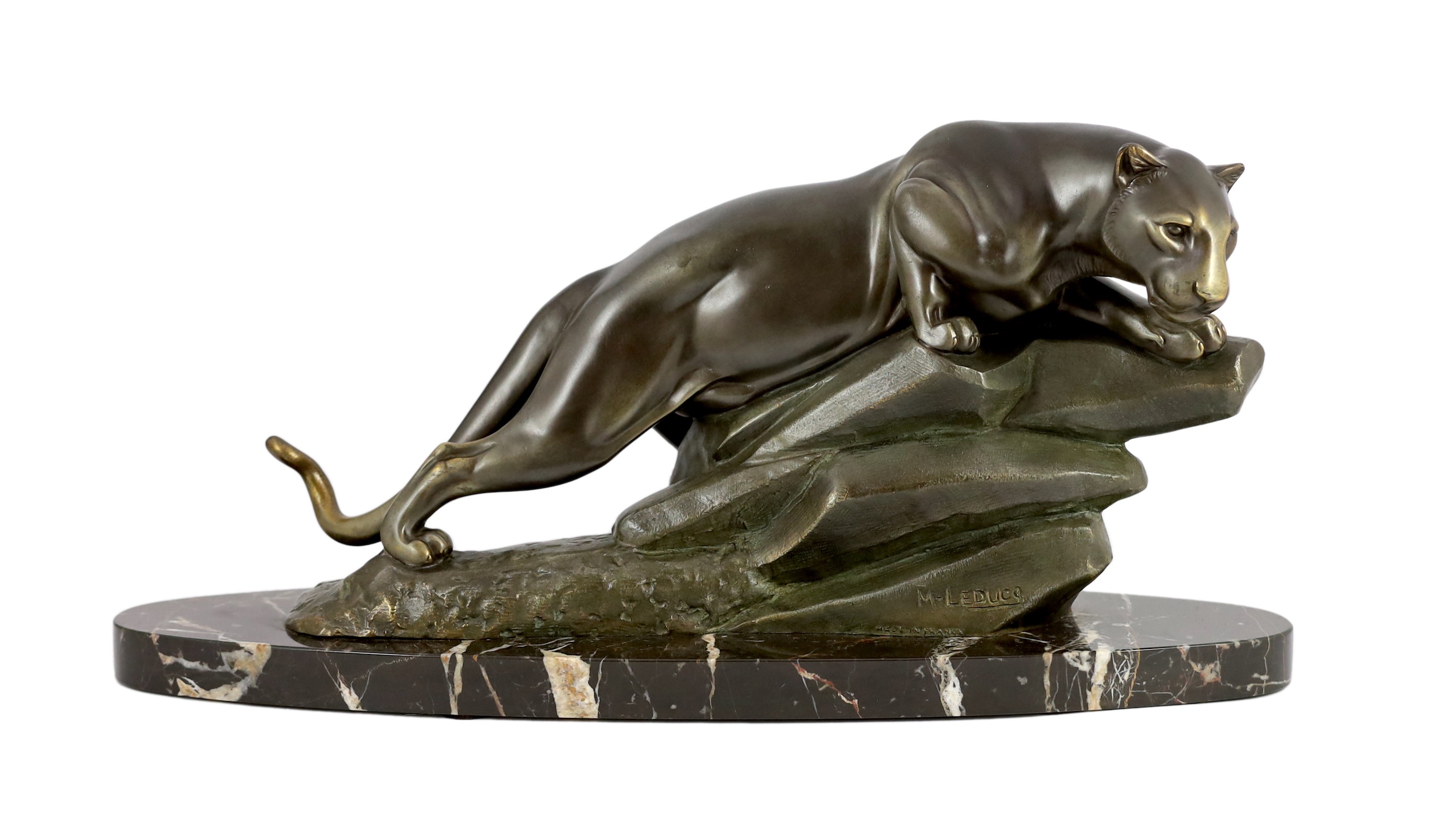 M. Leducq. NB. A patinated spelter model of a panther crouched upon a rock, width 60cm height 29cm